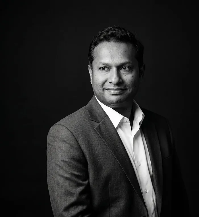 Portrait of Vinay Babu, co-founder of Krismar Realty and Managing Director of Krismar Marbles